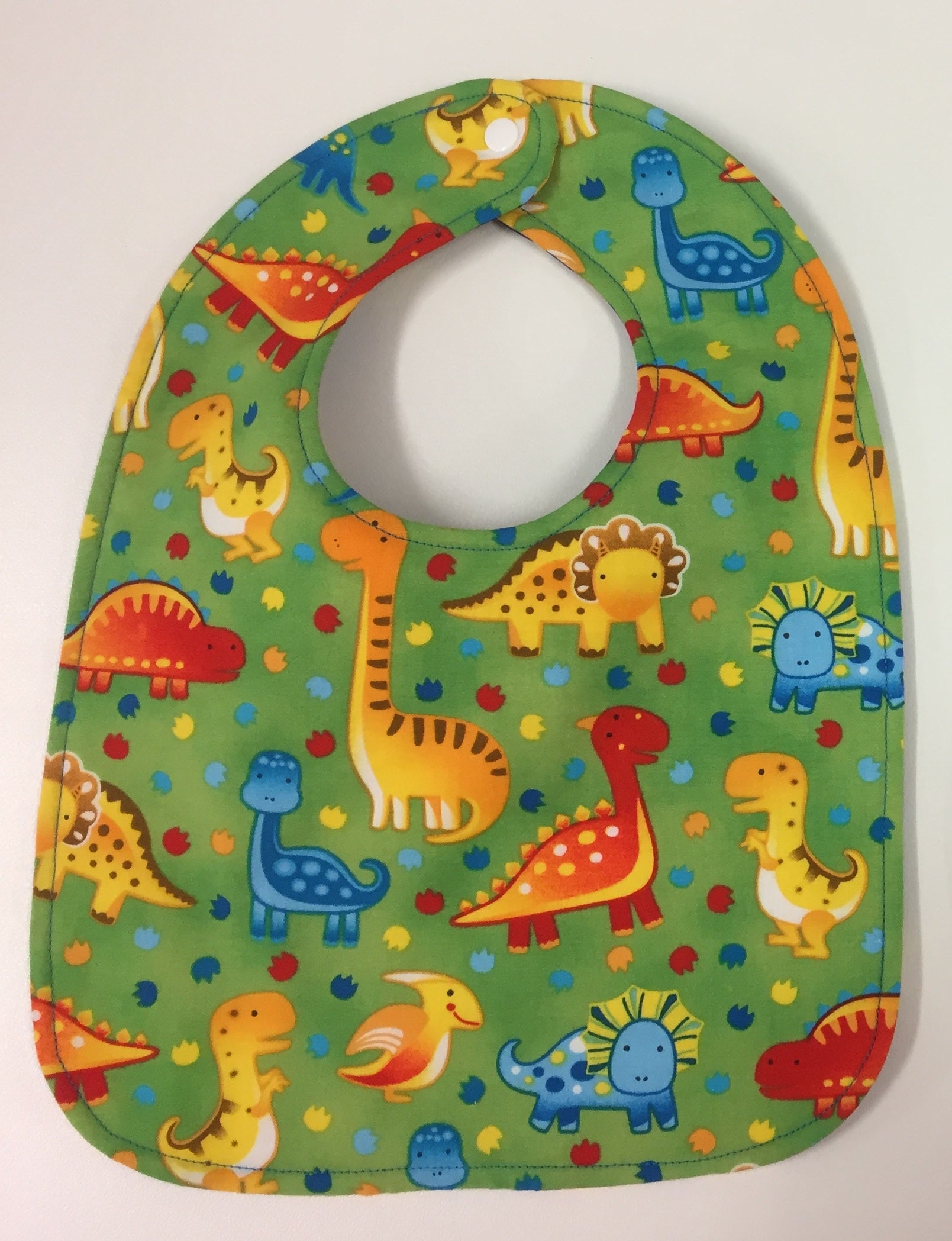 Reversible Bib – Green Dinosaurs / Blue Dinosaurs