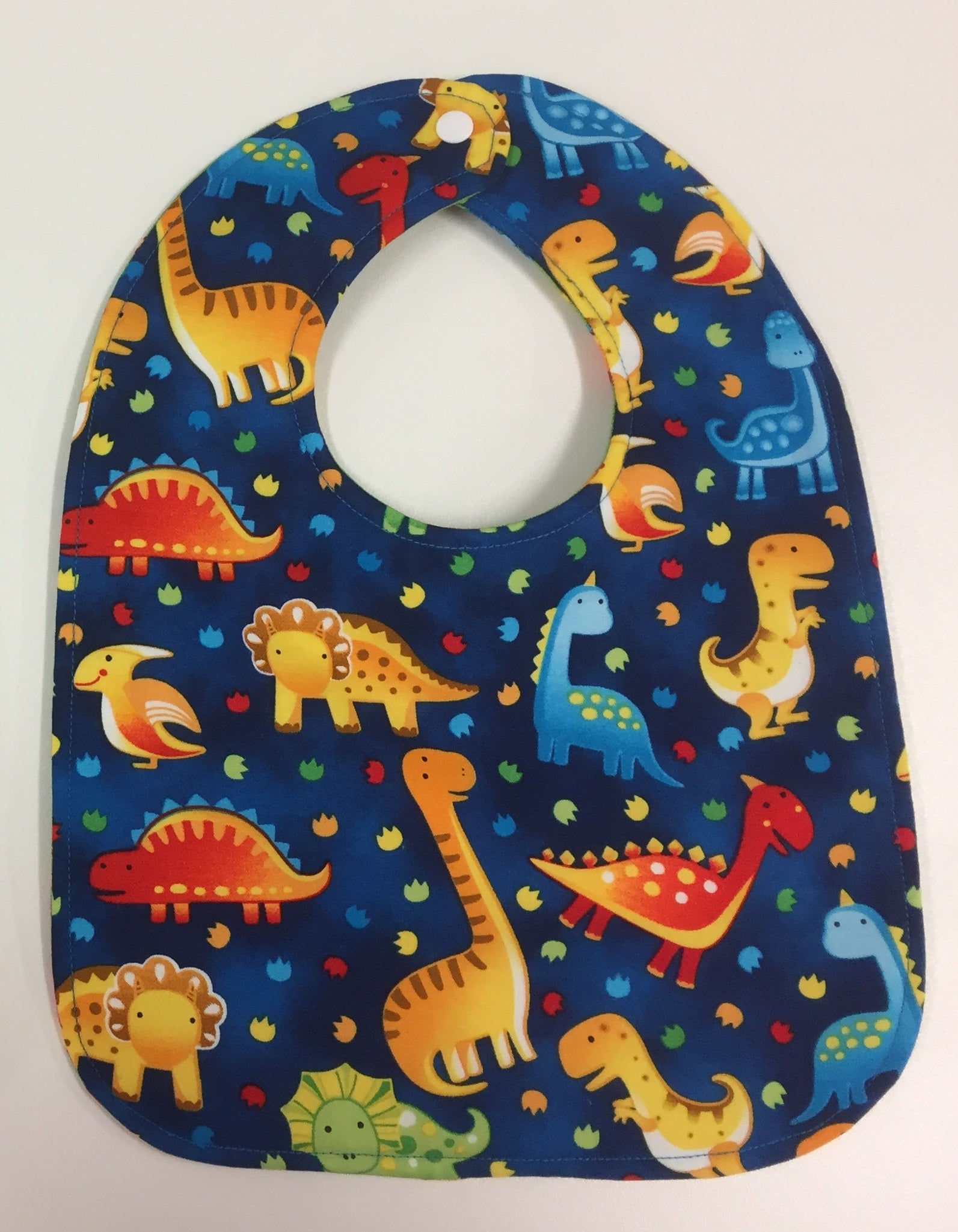 Reversible Bib – Green Dinosaurs / Blue Dinosaurs
