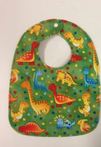 Reversible Bib – Green Dinosaurs / Blue & White with Spots