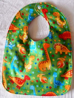 Reversible Bib – Green Dinosaurs / White with Spots