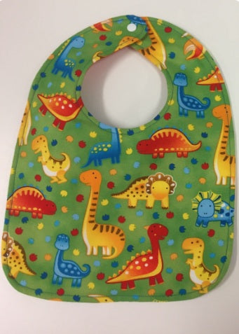 Reversible Bib – Green Dinosaurs / Yellow with Spots