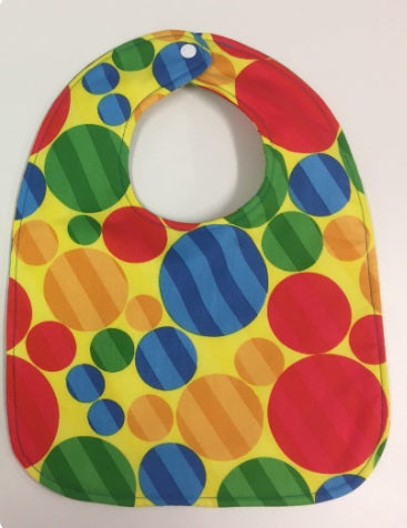 Reversible Bib – Green Dinosaurs / Yellow with Spots