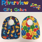 Reversible Bib – Blue Dinosaurs / Yellow with Spots