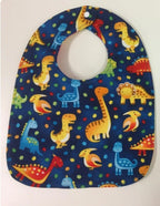 Reversible Bib – Blue Dinosaurs / Yellow with Spots