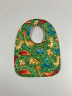 Reversible Bib – Green Dinosaurs / Red with Spots
