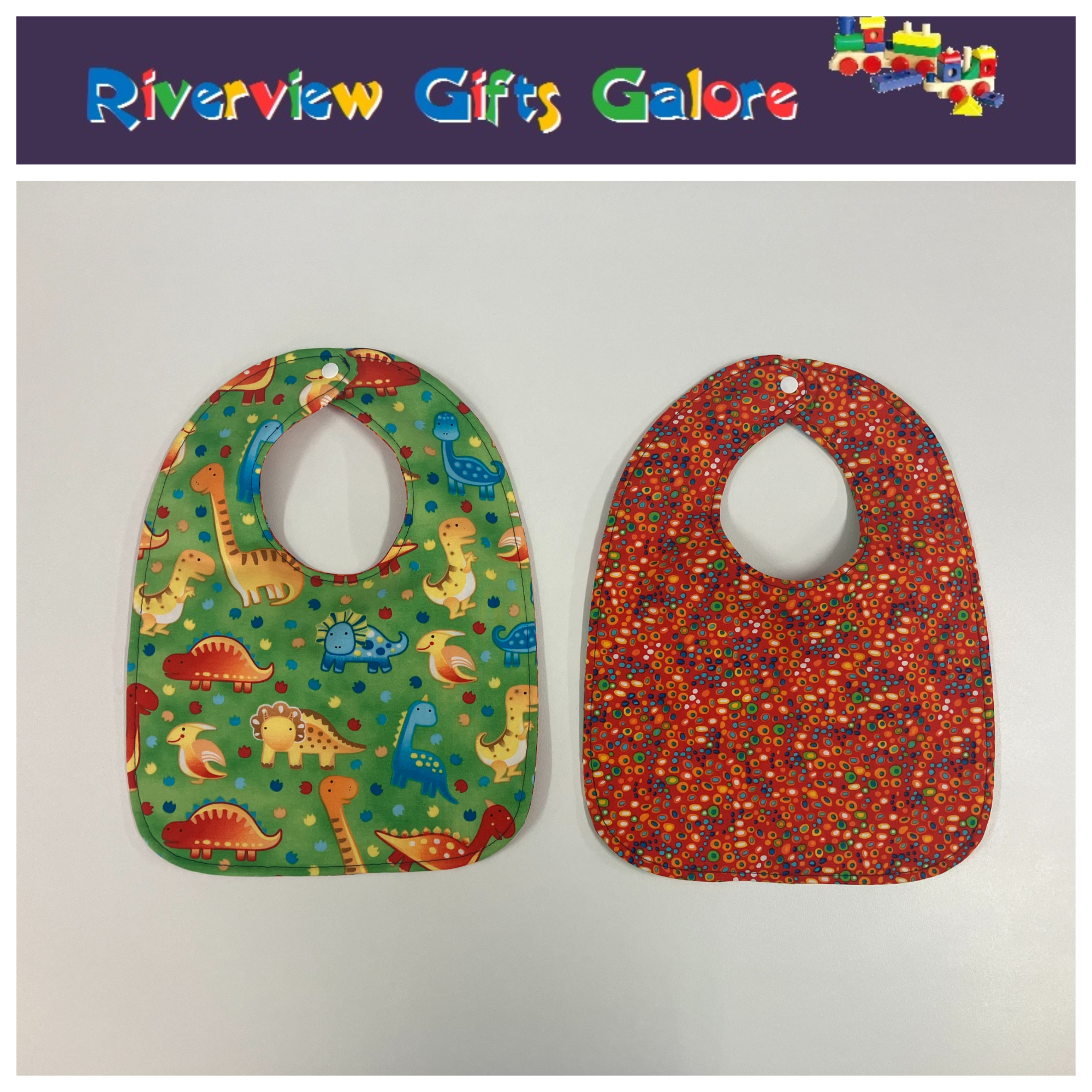 Reversible Bib – Green Dinosaurs / Red with Spots
